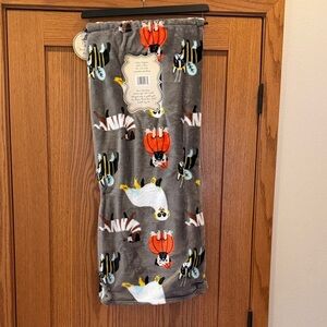 Cozy Halloween Throw with Digs in Costumes